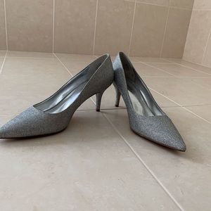 Silver rhinestone crusted pumps.